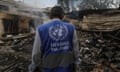 An UNRWA employee inspects a destroyed school following an air strike in Al Nuseirat refugee camp, central Gaza Strip earlier this month.