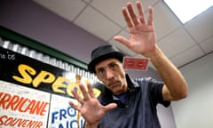 Paul Carpenter, a New Orleans magician, performs card tricks during an interview in New Orleans, Friday, Feb. 23, 2024. Carpenter says he was hired in January by Steve Kramer, who has worked on ballot access for Democratic presidential candidate Dean Phillips, to use AI software to imitate President Joe Biden's voice to convince New Hampshire Democrat voters not to vote in the state's presidential primary. (AP Photo/Matthew Hinton)