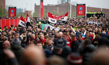 Manchester United fans march to Old Trafford to demand 100% sale – video