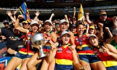 Erin Phillips, Ebony Marinoff, Danielle Ponter, Marijana Rajcic, Stevie-Lee Thompson and Nikki Gore of the Crows celebrate with fans after the AFLW grand final at Adelaide Oval. 