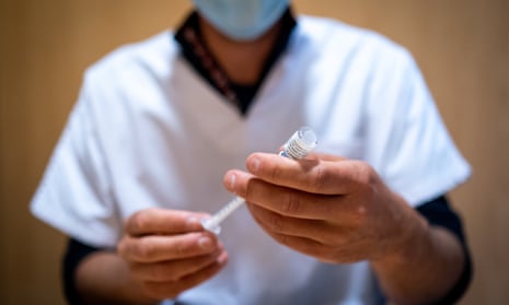 A health worker prepares a Covid-19 vaccine