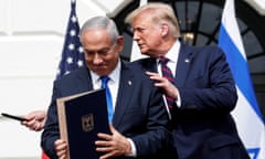 Benjamin Netanyahu stands with Donald Trump after signing the Abraham Accords, normalizing relations between Israel and some Middle East neighbors.