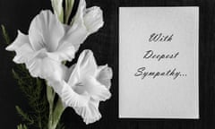 White condolence card with text saying 'with deepest sympathy ... ' and white gladiolus flower on a dark background