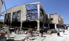 Yemenis inspect the wreckage of  a funeral hall in Sana’a wrongly targeted by Saudi-led airstrikes in an attack that killed 140 people