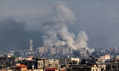 Smoke billows over buildings in Rafah