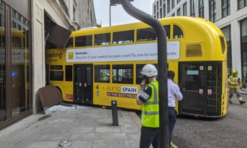 A double-decker bus that crashed into a pub on New Oxford Street in London