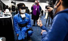 An CES attendee tries out the HaritoraX full-body tracking system for an immersive VR experience.