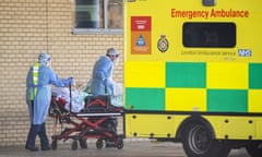 UK In Fifth Week Of Coronavirus Lockdown<br>LONDON, UNITED KINGDOM - APRIL 21: NHS workers in PPE take a patient with an unknown condition to an ambulance at Queens Hospital on April 21, 2020 in London, England. The British government has extended the lockdown restrictions first introduced on March 23 that are meant to slow the spread of COVID-19. (Photo by Justin Setterfield/Getty Images)