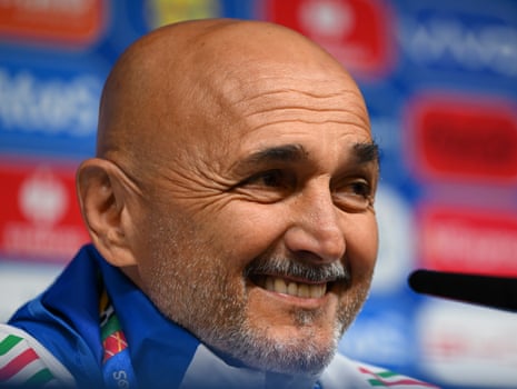 Luciano Spalletti, Italy head coach, smiles in a press conference.