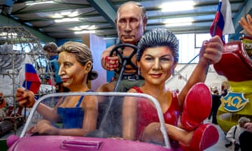 A carnival float with a figure depicting Russian President Vladimir Putin, center, is presented during a press preview for the Mainz carnival in Mainz, Germany, Tuesday, Feb.6, 2024. At left head of German AfD party (Alternative for Germany)  Alice Weidel, at right Sarah Wagenknecht who recently founded her own party BSW