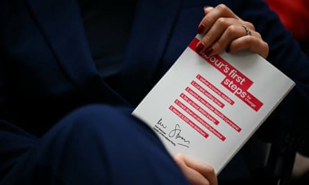 Rachel Reeves holds the Labour Party election manifesto booklet during its lauching, in Manchester, on June 13, 2024.