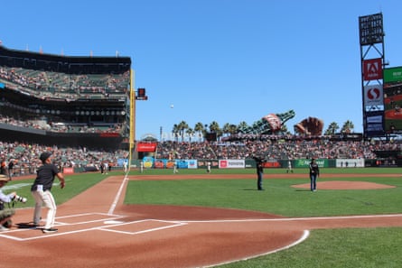 Wide view of Cooley throwing pitch