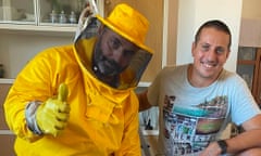 Andrea Lunerti in a bright yellow beekeepers' costume