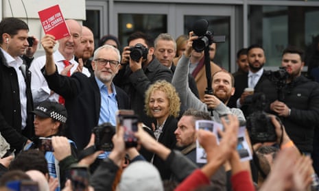 Jeremy Corbyn holds up Labour’s manifesto in Swansea, December 2019. 