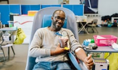 A man donates blood in Croydon, south London.