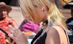 A teenage girl uses her smartphone in Santa Fe, New Mexico.