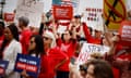 people hold signs calling for gun control