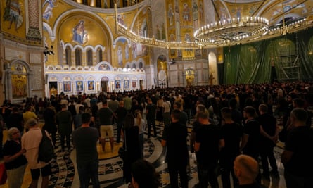 Red Star Belgrade fans attend the liturgy for the three killed Serbs in Belgrade, Serbia, on 27 September.