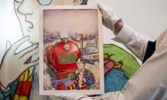 An art handler wearing white gloves holds up the framed cover art, which shows Harry standing in front of a train before heading to Hogwarts