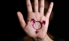 Transgender symbol painted in the palm of a hand