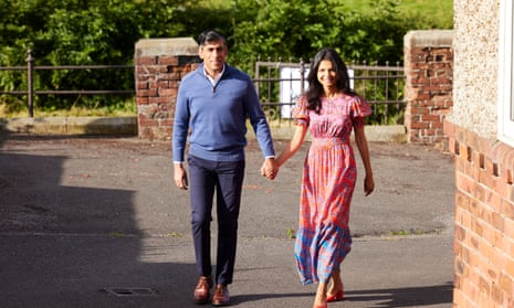 Prime minister Rishi Sunak and his wife, Akshata Murty arrive to cast their vote at Kirby Sigston and District Village Hall, North Yorkshire.