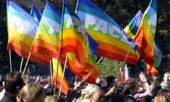 Participants of Belgrade Gay Pride parade wave flags in Belgrade