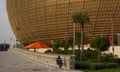 A security guard sits outside Lusail Stadium in Qatar