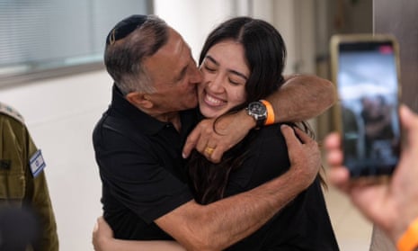 Noa Argamani hugs her father after being rescued from Gaza in a special operation by Israeli forces yesterday.