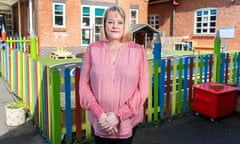 Amanda Richards beside a school playground