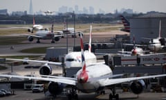 Aircrafts taxi at Heathrow airport.