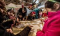 Migrant children attend a lesson in a makeshift school at the camp in Calais, on 10 February 2016.