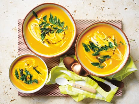 Alice Zaslavsky’s orange vegetable soup is ‘like a hug in a mug’ garnished with curry leaves, mustard seeds and a swish of coconut cream. 