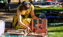 Young woman Browsing vinyl at pop-up flea market in the Kallio district of Helsinki,