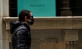 A man passes by the closed Tiffany &amp; Co store on Wall St. in the financial district of New York City