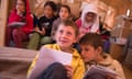 Children attend an English lesson inside a tent at the makeshift migrants and refugees camp at the Greek-Macedonian border near the village of Idomeni on May 2, 2016.
Some 54,000 people, many of them fleeing the war in Syria, have been stranded on Greek territory since the closure of the migrant route through the Balkans in February.  / AFP PHOTO / TOBIAS SCHWARZTOBIAS SCHWARZ/AFP/Getty Images