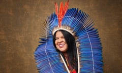 Sonia Guajajara wearing a blue Indigenous headdress