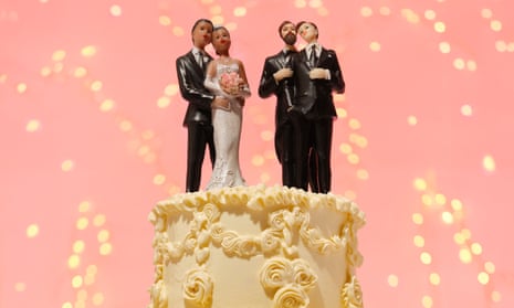 Still life photo of four figurines on a wedding cake