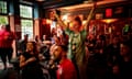 Happy people celebrating in a pub