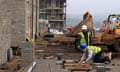 Construction workers build new houses on a residential building site in Paulton on November 21, 2011 near Bristol, England.