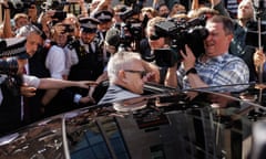 Huw Edwards leaves court surrounded by press and police