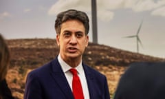 Ed Miliband wearing a dark jacket and a red tie