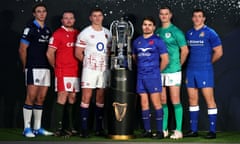 Six Nations captains Jamie Ritchie, Ken Owens, Owen Farrell, Antoine Dupont, Johnny Sexton and Michele Lamaro pose with the Six Nations trophy.