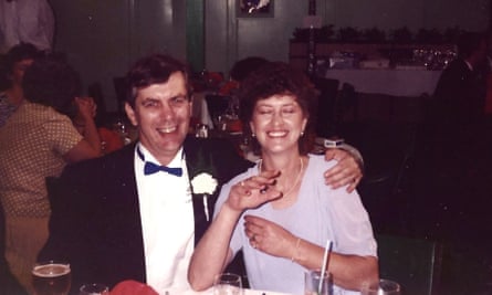 A man and woman looking delighted at the reception of their daughter’s wedding.