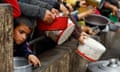 People queue to receive food in Rafah