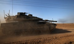 An Israeli armoured fighting vehicle manoeuvres at a position near the border with the Gaza Strip in southern Israel.