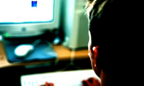 Adolescent Boy using Computer