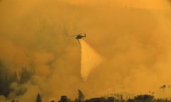 A Sikorsky Skycrane helicopter drops water on the Grizzly Creek Fire on the east end of Glenwood Canyon, Monday, Aug. 17, 2020 near Glenwood Springs, Colo. Four large wildfires continue to burn in hot and dry weather in Colorado. (Helen H. Richardson/The Denver Post via AP)