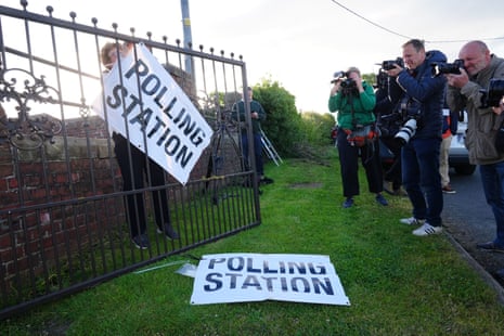 Members of the media photograph a sign outside the polling station in Kirby Sigston.