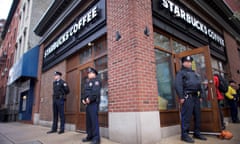 Police officers monitor activity outside as protestors demonstrate inside a Center City Starbucks, where two black men were arrested, in Philadelphia, Pennsylvania U.S., April 16, 2018. REUTERS/Mark Makela TPX IMAGES OF THE DAY