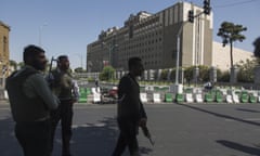 Police in the area of Iran’s parliament building.
